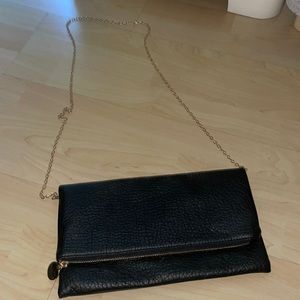 Black over the shoulder bag. With gold chain